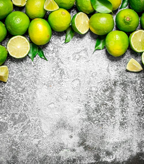Preview: Ripe Lime With Green Leaves. On Rustic Background.