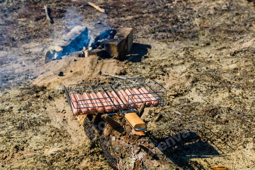 Preview: Raw Sausages In Barbecue Grill Before Cooking
