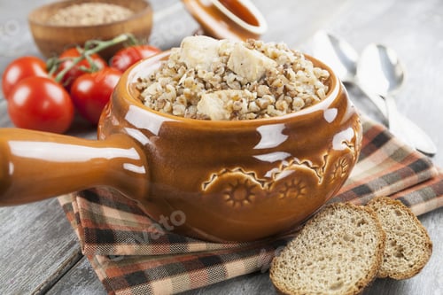 Preview: Buckwheat Porridge With Meat In A Ceramic Pot On The Table