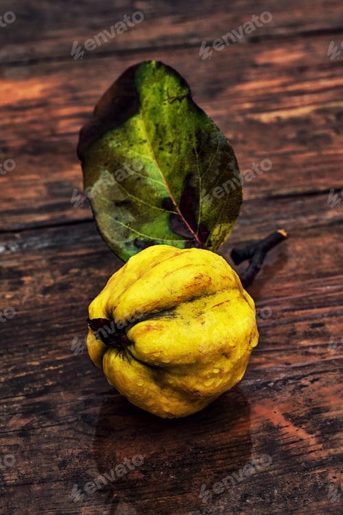 Preview: Juicy,Ripe Quince Fruit On Wooden Top