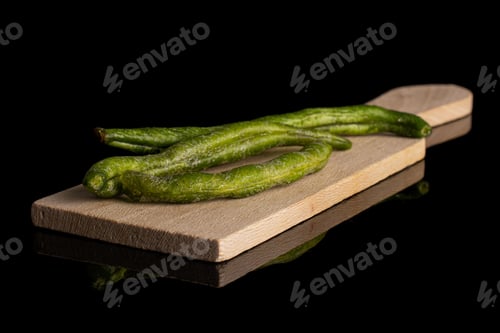 Preview: Group Of Three Whole Dry Vegetable Chip Of Green Bean On Small Wooden Cutting Board Isolated On