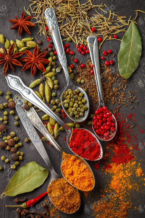 Preview: Variety Of Natural Spices, Seasonings And Herbs In Spoons On The Stone Table - Paprika, Curry