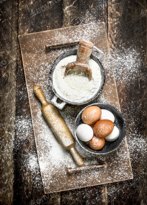 Preview: Flour With Fresh Eggs. On A Wooden Background.