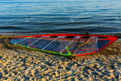 Preview: Windsurfing Sail On A Sand At Sea Shore