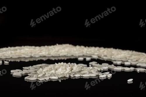 Preview: Lot Of Whole White Jasmine Rice Grains Isolated On Black Glass