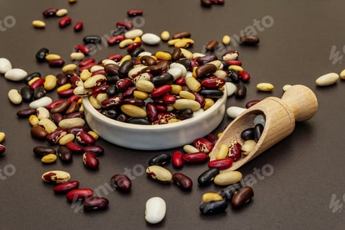 Preview: Assorted Different Types Of Beans In Ceramic Bowl. Mix Of Various Dry Legumes Scattered On Black