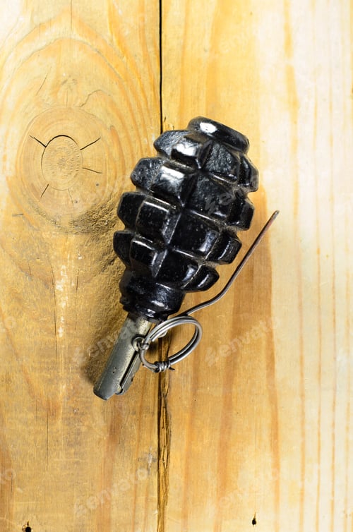 Preview: Black Hand Grenade On The Wooden Table
