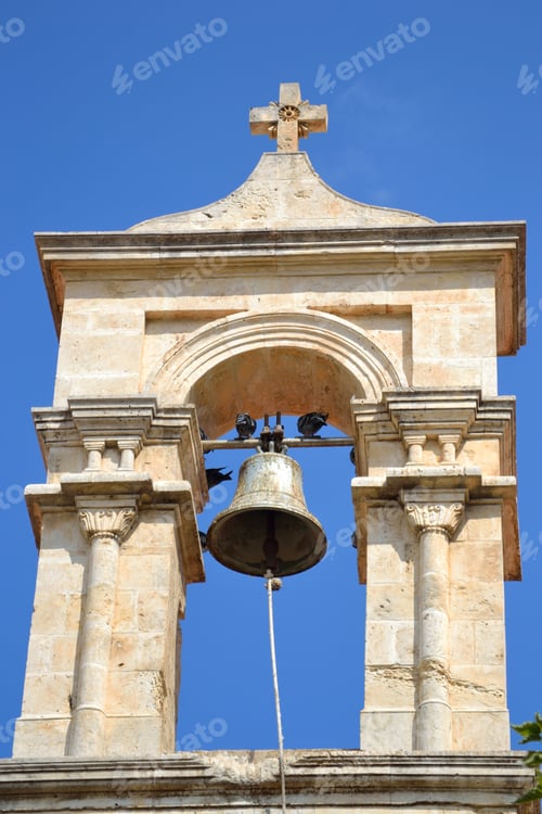 Preview: Church Bell Tower On Blue Sky Background On Crete Island, Greece.