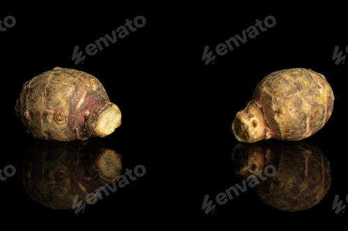 Preview: Group Of Two Whole Fresh Brown Jerusalem Artichoke Isolated On Black Glass