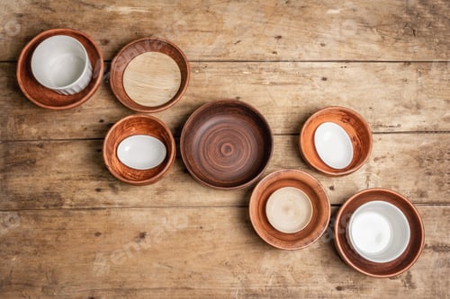 Preview: Handmade Empty Ceramic Dishes And Plates On Wooden Background. Collections Of Various Bowls
