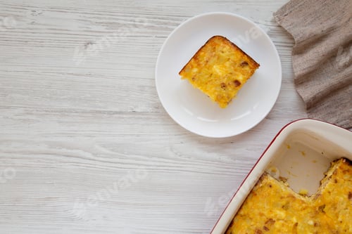 Preview: Homemade Cheesy Amish Breakfast Casserole On A White Wooden Surface, Top View. Flat Lay, Overhead