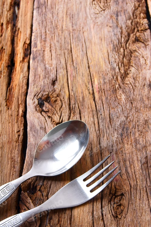 Preview: Spoon And Fork On Wood.