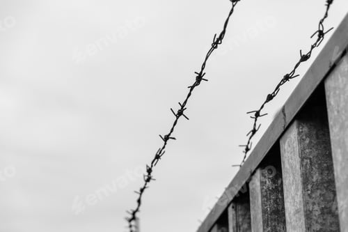 Preview: Barbed Wire Against Sky On Cloudy Day