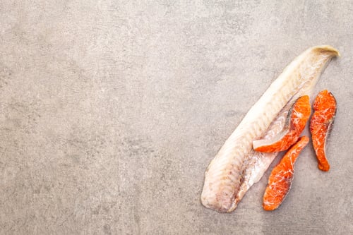 Preview: Assorted Frozen Fish. Hake Fillet And Salmon Pieces. Ingredients For Healthy Food Cooking. Stone