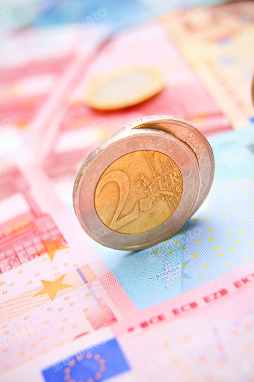 Preview: Euros Of A Coin On Banknotes.