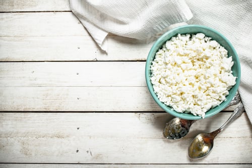 Preview: Cottage Cheese From Fresh Milk In A Bowl. On A White Wooden Table.