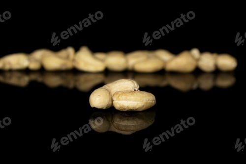 Preview: Lot Of Whole Brown Nut Cashew Two In Focus Isolated On Black Glass