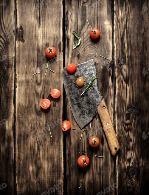Preview: Knife And Red Tomatoes. On Wooden Background.