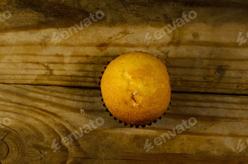 Preview: Fresh Cupcake On The Old Wooden Table