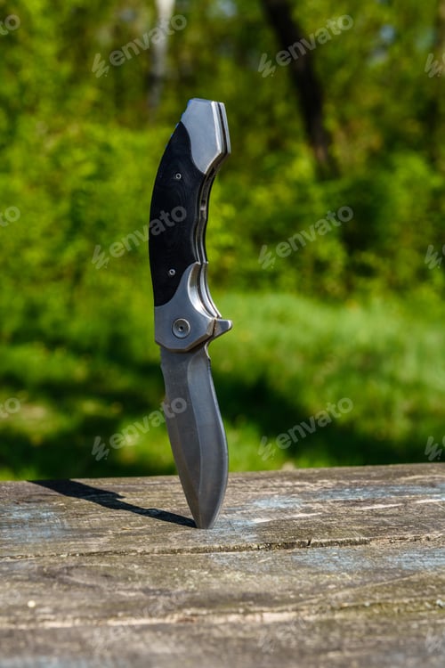 Preview: Folding Knife Stuck In Old Wooden Board