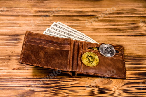 Preview: Brown Leather Wallet, Bitcoins And One Hundred Dollar Banknotes On Wooden Background