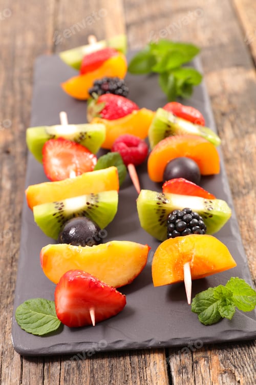 Preview: Colorful Fruit Skewers with Mint Leaves on Platter