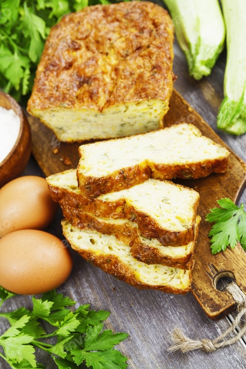 Preview: Pie With Zucchini, Cheese And Herbs On The Table