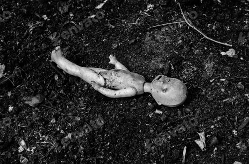 Preview: Old Broken Doll On The Pile Of Ash