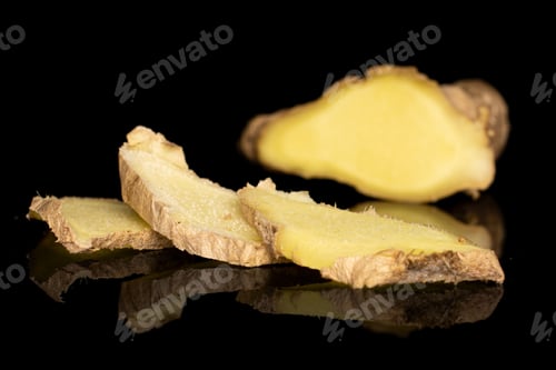 Preview: Group Of Four Slices Of Fresh Brown Ginger Isolated On Black Glass