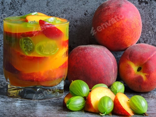 Preview: Detox Drink With Peach Slices. Pieces Of Peach. Tight Gooseberries.