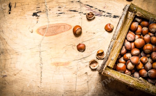 Preview: Nuts In A Basket. On A Wooden Table.