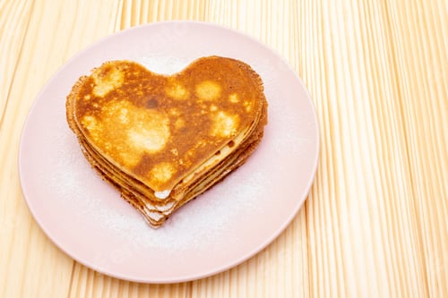 Preview: Heart Shaped Pancakes For Romantic Breakfast. Shrovetide (Carnival) Concept. On Wooden Background.