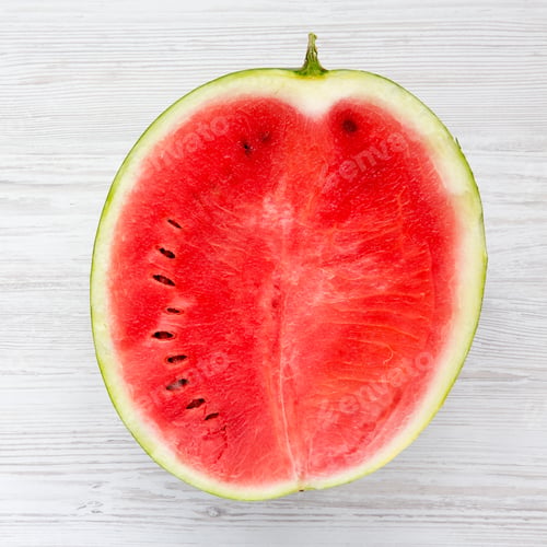 Preview: Half Cutted Watermelon On White Wooden Table. Close-Up.