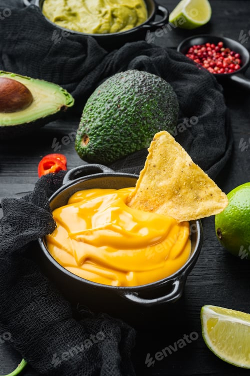 Preview: Creamy Cheddar Sauce With Chia Seeds In Bowl, On Black Wooden Background