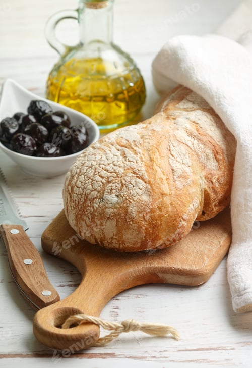 Preview: Ciabatta With Olives. Fresh Delicious Traditional Italian Bread, Olives And Olive Oil On A White