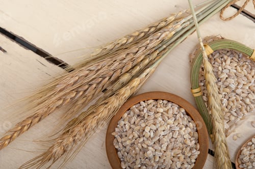 Preview: Organic Barley Grains Over Rustic Wood Table Macro Closeup