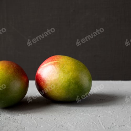 Preview: Two Colorful Sweet Mangoes, Side View. Closeup.