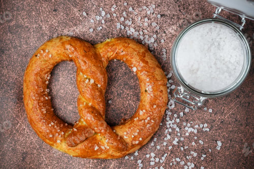 Preview: Freshly Baked Homemade Pretzel With Coarse Sea Salt. German (Bavarian) Beer Appetizer. Selective