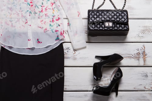 Preview: Heel Shoes And Clutch Bag. Light Top And Dark Footwear. Luxury Shoes From Brand Store. Spring