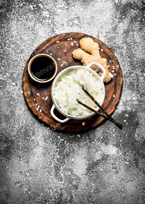 Preview: Asian Food. Boiled Rice With Soy Sauce On The Old Board. On Rustic Background. Japanese Cuisine