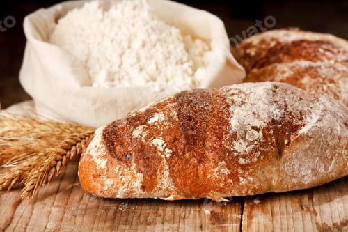 Rustic Bread Loaves with Flour and Wheat