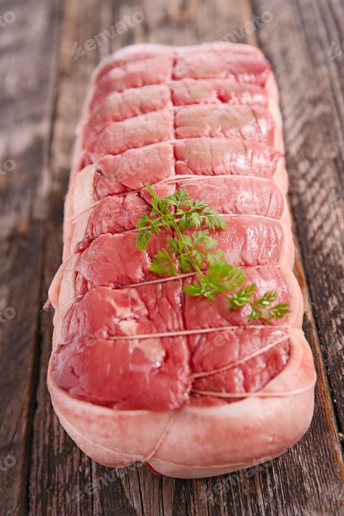 Raw Beef Roast on Rustic Wooden Surface