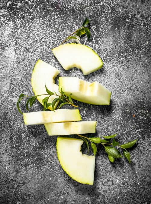 Preview: Fresh Ripe Sliced Melon. On A Rustic Background.