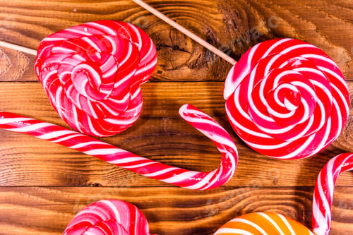 Preview: Different Sweet Lollipops On A Rustic Wooden Table. Top View
