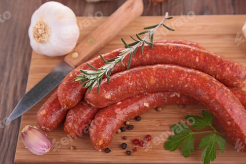 Sausages with Fresh Herbs on a Wooden Board