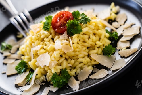 Preview: Risotto With Parmesan On Black Stone Plate