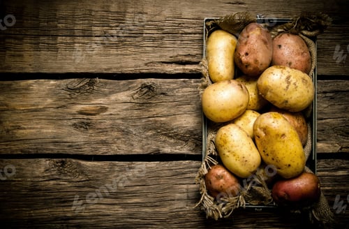 Preview: Raw Potato Food . Potatoes In An Old Box On A Wooden Table . Free Space For Text. Top View