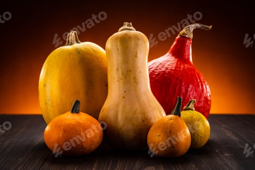 Preview: Mix Of Various Pumpkins On Wooden Background