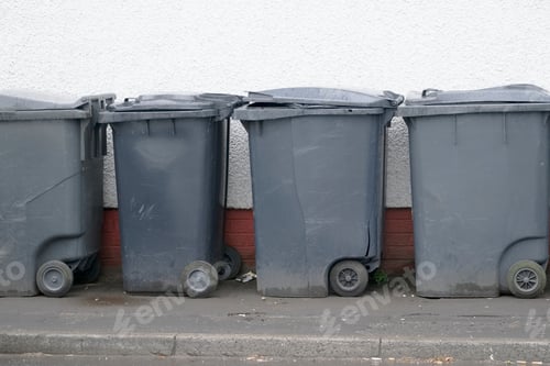 Preview: Black Wheelie Bins In A Row On Street