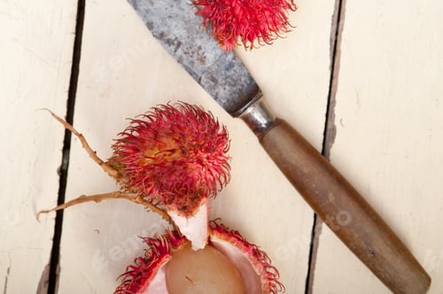 Preview: Fresh Tropical Rambutan Fruits Over Rustic Wood Table